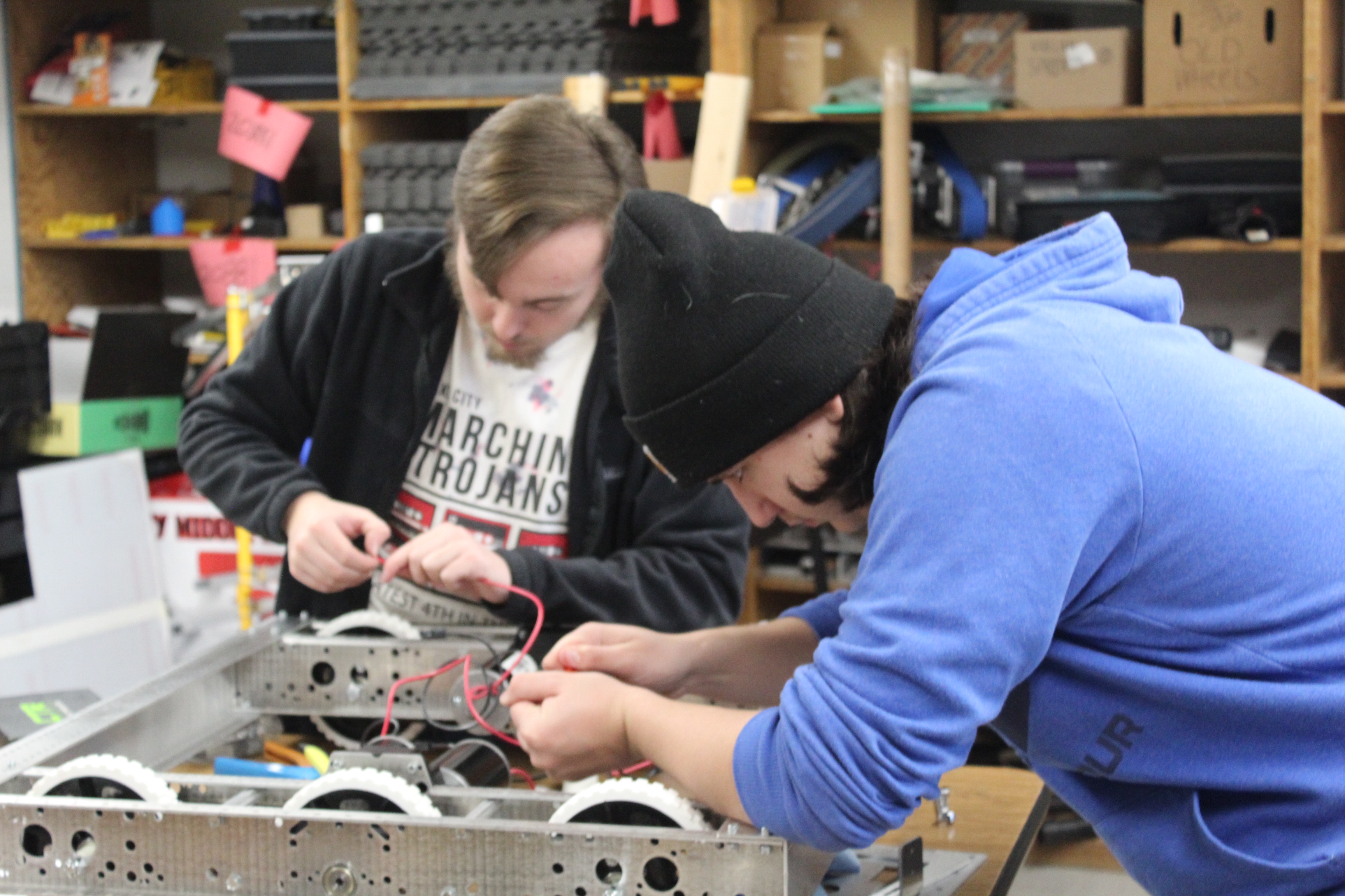 Ultrabots team collaborating on robot wiring